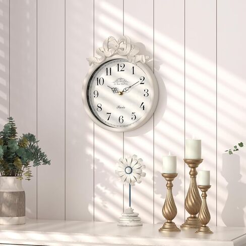 ساعة حائط فرنسية صغيرة مع فيونكة، طراز بوهو أبيض عاجي عتيق، ساعات حائط مزخرفة تعمل بالبطارية الصامتة للمزرعة وغرفة النوم والحمام وهدايا المنزل الجديد (10 بوصة ارتفاع × 7.9 بوصة عرض) in Kuwait