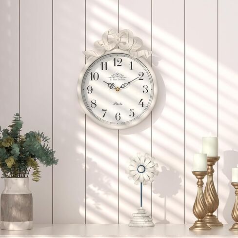 ساعة حائط فرنسية صغيرة مع فيونكة، طراز بوهو أبيض عاجي عتيق، ساعات حائط مزخرفة تعمل بالبطارية الصامتة للمزرعة وغرفة النوم والحمام وهدايا المنزل الجديد (10 بوصة ارتفاع × 7.9 بوصة عرض) in Kuwait