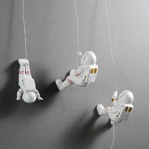 AWNR 3Pcs Climbing Astronaut Figurine Wall Hanging Decor Modern Home Decor Outer Space Theme Decorations Wall Sculptures Space Decor Background 3D Wall Decor for Bedroom Living Room in Saudi Arabia