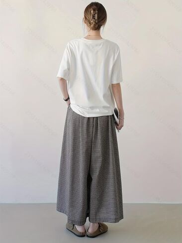 Retro-Style Wide-Leg Straight-Leg Pants with a Black and White Checkered Pattern and a Relaxed fit. in Saudi Arabia