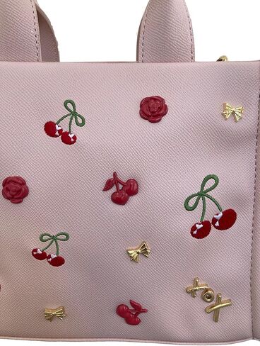 Betsey Johnson XO Nora Textured Blush Faux Leather 3D Red Roses, Gold Tone Bows, XOX Betsey Heart & Insignia with 3D & Embroidered Cherries Detail SMALL Top Handle Tote Shoulder Bag Handbag in Saudi Arabia
