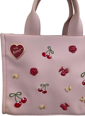 Betsey Johnson XO Nora Textured Blush Faux Leather 3D Red Roses, Gold Tone Bows, XOX Betsey Heart & Insignia with 3D & Embroidered Cherries Detail SMALL Top Handle Tote Shoulder Bag Handbag in Saudi Arabia