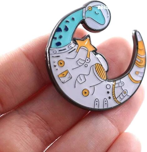 Compoco Dinosaur Lapel Enamel Pin Dinomoon Space Astronaut Suit Moon Shaped Holding a Star in Kuwait