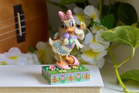 Enesco Disney Traditions Collection by Jim Shore Daisy Duck with Flowers and Butterflies Figurine- Stone Resin Hand Painted Collectible Disney Figurines Home Decor Statue, 5 Inch in Saudi Arabia