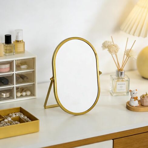 مرآة زينة بيضاوية مع حامل، إطار معدني ذهبي، مرآة مكياج على سطح الطاولة (ذهبي، 5.9 × 8.9 بوصة) in Kuwait