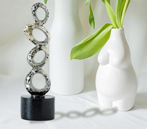 تمثال راتينج تجريدي حديث - حلقات بيضاوية ذهبية غير منتظمة مع قاعدة أسطوانية سوداء لديكور المنزل والمكتب الأنيق in Kuwait