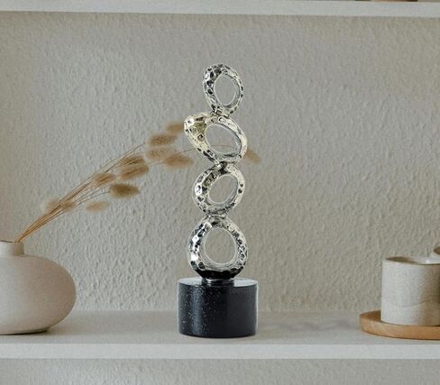 تمثال راتينج تجريدي حديث - حلقات بيضاوية ذهبية غير منتظمة مع قاعدة أسطوانية سوداء لديكور المنزل والمكتب الأنيق in Kuwait