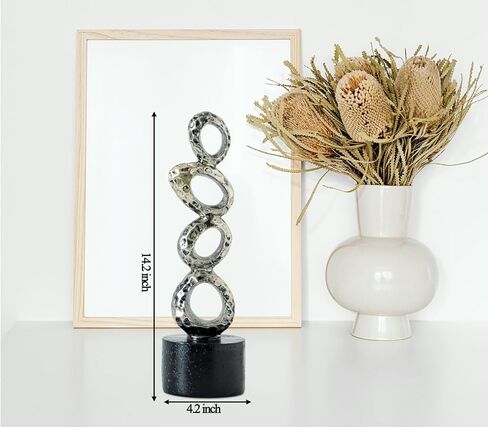 تمثال راتينج تجريدي حديث - حلقات بيضاوية ذهبية غير منتظمة مع قاعدة أسطوانية سوداء لديكور المنزل والمكتب الأنيق in Kuwait