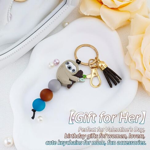 هدايا الكسلان للنساء والفتيات سلسلة مفاتيح زينة أشياء الكسلان ديكور من السيليكون مع خرز حقيبة شرابة لمحبي الكسلان - حقيبة يد، محفظة، حقيبة ظهر، حلقة مفاتيح، ملحقات مفاتيح السيارة in Saudi Arabia