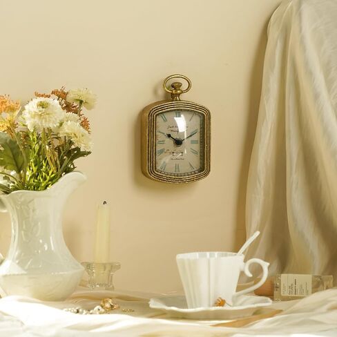 ساعة حائط صغيرة ذهبية عتيقة من NIKKY HOME، ساعات تناظرية معدنية مزخرفة صامتة تعمل بالبطارية للحمام والمطبخ وغرفة المعيشة وغرفة النوم والمكتب (6.1 بوصة ارتفاع × 3.7 بوصة عرض) in Saudi Arabia