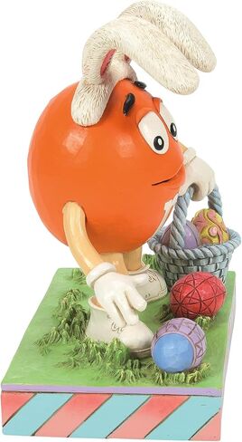 Enesco M&M's by Jim Shore Orange Character Easter Egg Hunt Figurine, 5.51 Inch, Multicolor in Saudi Arabia