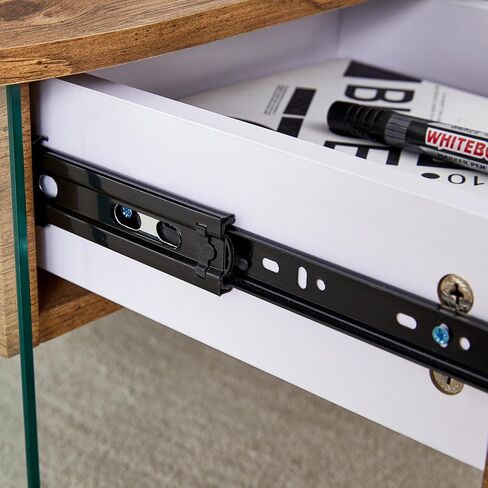 Coffee Table with Double Drawers. The Board Surface is MDF Sticker, and Both Sides are Transparent Tempered Glass. The Design is Simple and Elegant, with Excellent Storage Functions. RR in Saudi Arabia
