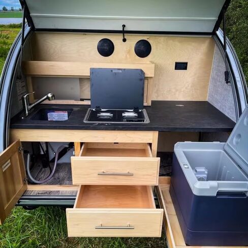 Rugged All-Terrain Teardrop Camper Trailer Luxury Travel Trailer, Designed for Rock Crawling Adventures and Overlanding Convoys, Featuring Integrated LED Light Bar and Spare Tire Mount in Saudi Arabia