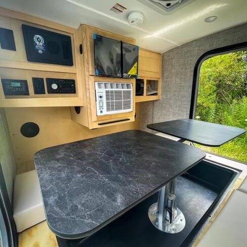 Rugged All-Terrain Teardrop Camper Trailer Luxury Travel Trailer, Designed for Rock Crawling Adventures and Overlanding Convoys, Featuring Integrated LED Light Bar and Spare Tire Mount in Saudi Arabia