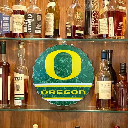 لافتة حائط بغطاء زجاجة معدنية من FOCO Oregon Ducks مقاس 13 بوصة NCAA، 13 بوصة - طراز عتيق متعثر، مرخصة رسميًا in Saudi Arabia