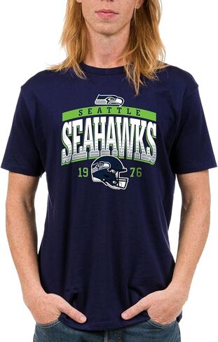 Junk Food x NFL - Mighty - Officially Licensed Adult Short Sleeve Fan T-Shirt for Men & Women in Saudi Arabia