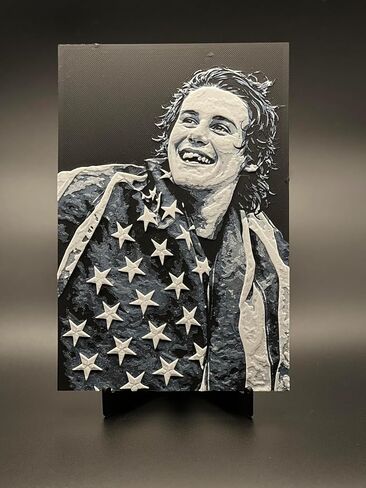 3D print of USA Hockey game winning scorer Jack Hughes wrapped in the American flag after USA Men's hockey wins the Gold medal. in Saudi Arabia