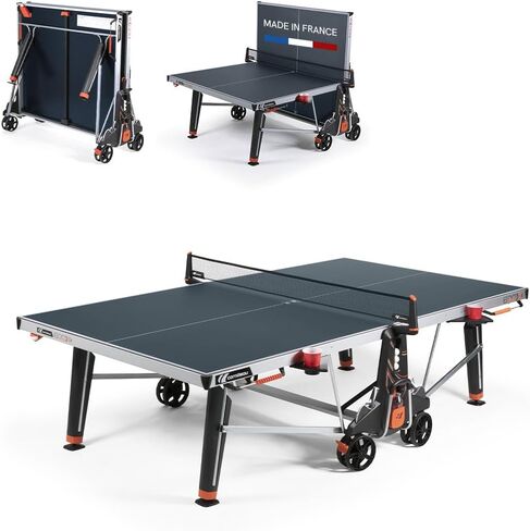 Cornilleau - طاولة التنس في الهواء الطلق 600x - قابلة للطي وضخمة - الطقس و schockproof - 7mm صفح أعلى - حامل كوب - عدادات النقاط - تخزين الكرة وموزعات - الأزرق أو الأسود in Kuwait