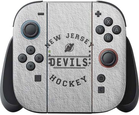 ملصق ألعاب Skinit متوافق مع وحدة تحكم Nintendo Switch 2 (2025) Joy-Con - تصميم خلفية صلبة مرخص رسميًا من NHL New Jersey Devils in Saudi Arabia