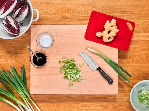 سكين سانتوكو بحافة مجوفة مقاس 5 بوصات من WÜSTHOF، أسود in Kuwait