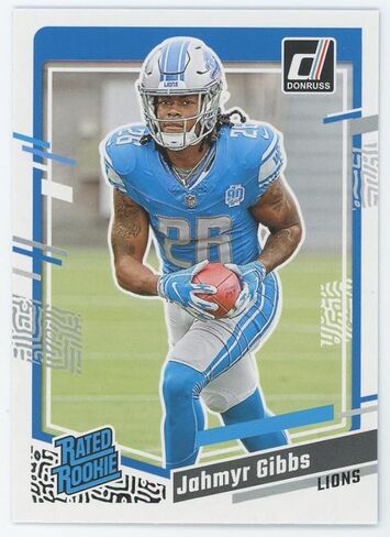 Jahmyr Gibbs 2023 Donruss Football Series Mint RATED ROOKIE Card #331 Picturing this Detroit Lions Star in his Blue Jersey in Kuwait