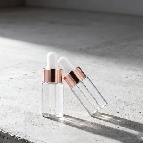 50 Pack 3ml Mini Clear Glass Essential Oil Dropper Bottle with Rose Gold Lid Sample Containers Perfume Liquid Vials for Traveling in Saudi Arabia