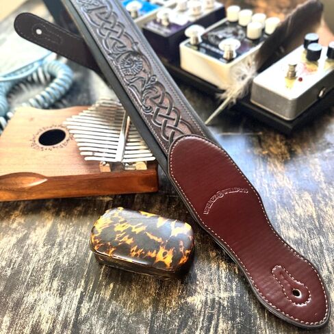 Walker And Williams KB-07 Dark Walnut Brown Body With Black Celtic Chain Carving Full Grain Carving Leather Padded Strap For Acoustic, Electric, And Bass Guitars in Saudi Arabia
