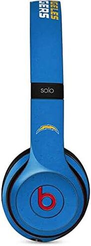 غلاف صوتي من Skinit متوافق مع Beats Solo 2 Wireless - شواحن مرخصة رسميًا من NFL Los Angeles - تصميم بديل متعثر in Saudi Arabia
