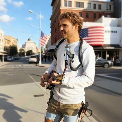 Neck-worn microphone stand with flexible boom arm - Hands-free microphone clip for outdoor concerts, street performances, solo recitals, and public speaking events in Saudi Arabia