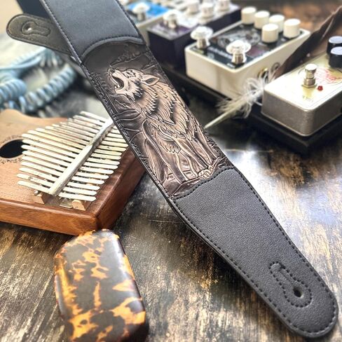 Walker & Williams CVG-WL-B Hand Carved Black And Tan Howling Timber Wolf On Black Leather Guitar Strap in Saudi Arabia