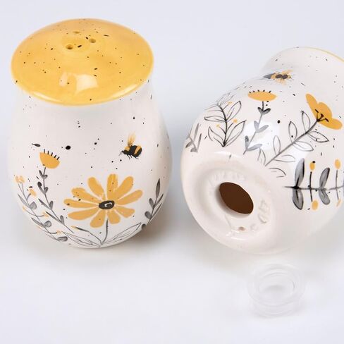 Primitives by Kathy Salt & Pepper Set - features bees buzzing over flowers with yellow accents. Shakers include unique openings to tell them apart, with plastic stoppers for easy refilling & cleaning in Saudi Arabia