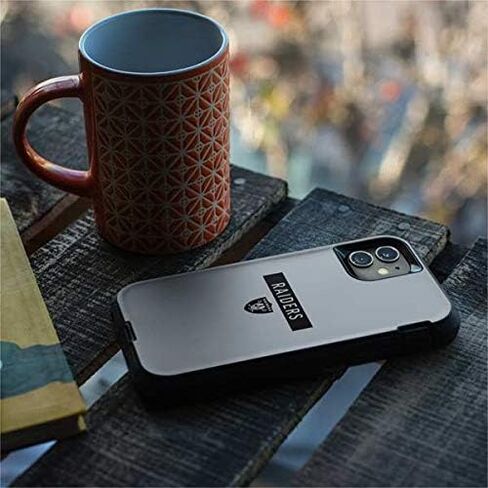 ملصق Skinit متوافق مع حافظة OtterBox Defender iPhone 11 - تصميم سلسلة الأداء الفضي من NFL Las Vegas Raiders المرخص رسميًا in Saudi Arabia