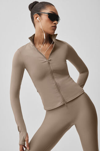 جاكيت Alo Yoga Airlift Winter Warm Radiant بسحاب كامل - حصى in Kuwait