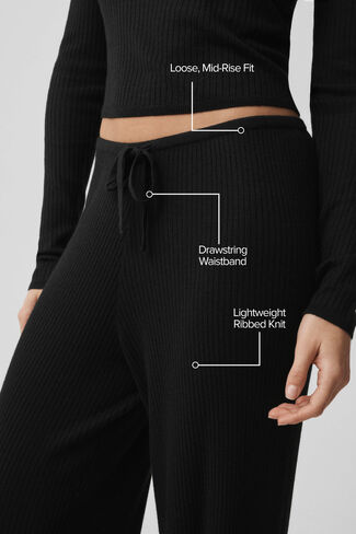 Alo Yoga Sweater Knit متوسط ​​الارتفاع Unwind واسع الساق - أسود in Kuwait