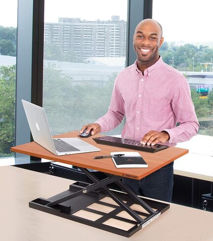 Stand Steady X-Elite Pro, Ergonomic Adjustable Height Standing Desk Converter for Home or Office, Easy Lift Sit to Stand Laptop Desk Riser for Laptop and Computer Monitor (Cherry, 28in x 20in) in Saudi Arabia