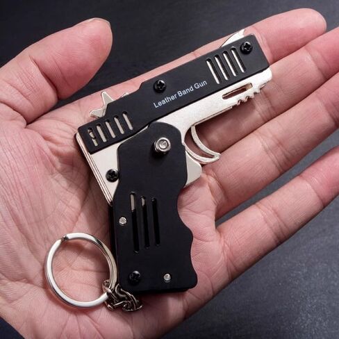 Mini Rubber Band Gun Metal Folding Gun Keychain with 100 Rubber Bands Made Entirely of zinc-Iron Alloy Material Sturdy and Durable (Black Leather Holster) in Saudi Arabia
