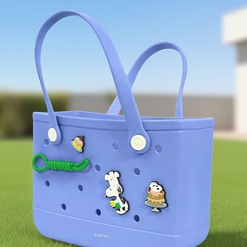MINISO Snoopy silicone perforated tote bag with charm, openwork design, blue, pink, and beige. in Saudi Arabia