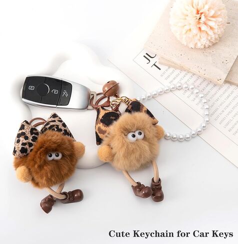 YOU WIZV Cute Plush Keychains for Women, Kawaii Anime Pom Pom Bag Charms with Bow Pearl Wristlet Key chain in Saudi Arabia