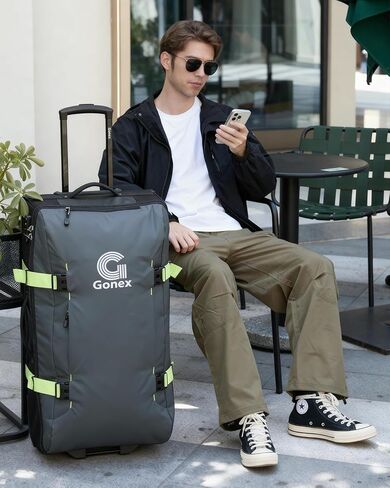 Gonex Rolling Duffle Bag with Wheels, Water-repellent 30 inch Nylon Large Wheeled Travel Duffel Luggage with TSA Lock & Telescopic Handle 100L, Navy Blue in Saudi Arabia