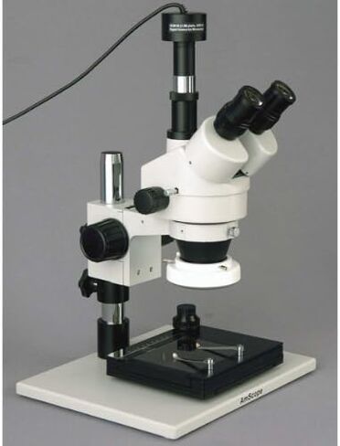 AmScope SM-1TZ-FRL-GT-8M Digital Professional Trinocular Stereo Zoom Microscope, WH10x Eyepieces, 3.5X-90X Magnification, 0.7X-4.5X Zoom Objective, 8W Fluorescent Ring Light, Large Pillar-Style Table Stand with Gliding Table, 110V-120V, Includes 0.5X and  in Kuwait