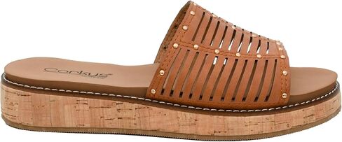 صندل نسائي من Corkys Footwear - يتميز بكعب 1 بوصة، ونعال داخلية مبطنة من مادة EVA للارتداء طوال اليوم، وجزء علوي مسامي مع فتحات ومسامير in Kuwait