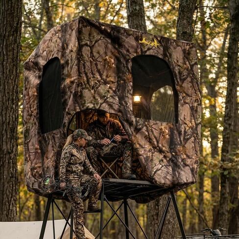 MUDDY Quad Pod Deluxe 12' Steel Hunting Stand with 57" x 57" Platform, Ladder Access, 2 Flex-Tek Seats, and Camo Blind, 500 Lb Weight Rating in Saudi Arabia