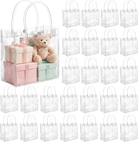Saintrygo 50 Pcs Clear Gift Bags with Handles PVC Plastic Bags Bulk Gift Wrap Tote Transparent Reusable Goodie Bags for Wedding Birthday Halloween Christmas Party Favor(10.2 x 6.3 x 3.2 Inches) in Saudi Arabia