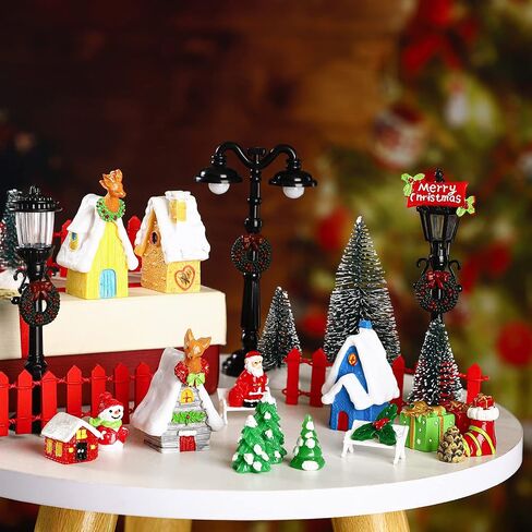 39 Pcs Christmas Village Houses Figurines Decoration Set Christmas Miniature Ornaments Mini Garden Accessories Kit with Santa Claus Snowmen Reindeer Bench Street Lamps Christmas Tree in Saudi Arabia