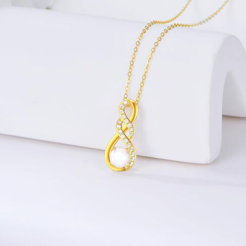 قلادات إنفينيتي من الذهب الخالص عيار 14 قيراط للنساء - قلادة أوبال إنفينيتي أنيقة من الذهب الأصفر بقلادة إنفينيتي in Kuwait