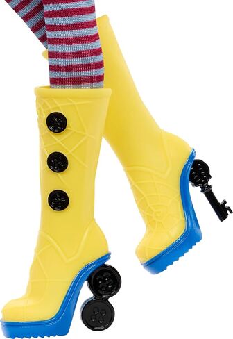 Monster High Skullector Doll, Coraline Collectible in Yellow Raincoat with Dress and Accessories Like Rag Doll, Cat Figure, and Doll Stand in Kuwait