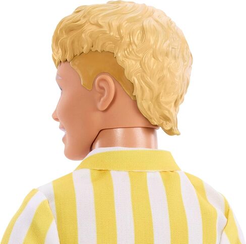 دمية كين من Barbie Fashionistas Style #252 ذات شعر أشقر، ترتدي شورتًا منقطًا باللونين البرتقالي والأصفر مع قميص مخطط باللونين الأصفر والأبيض، وحذاء برتقالي in Kuwait