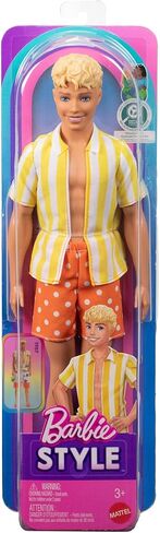 دمية كين من Barbie Fashionistas Style #252 ذات شعر أشقر، ترتدي شورتًا منقطًا باللونين البرتقالي والأصفر مع قميص مخطط باللونين الأصفر والأبيض، وحذاء برتقالي in Kuwait