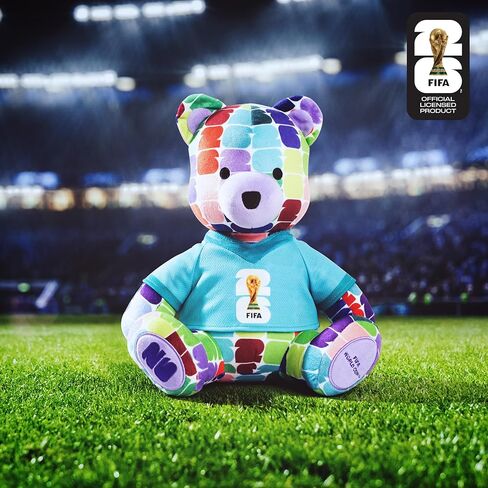 دب ملون من القطيفة مقاس 10 بوصات لكأس العالم FIFA 2026 من Jazwares - يمكن تجميع كأس العالم 2026 رسميًا مع تي شيرت بشعار كأس FIFA - للأعمار من 3 سنوات فما فوق in Kuwait