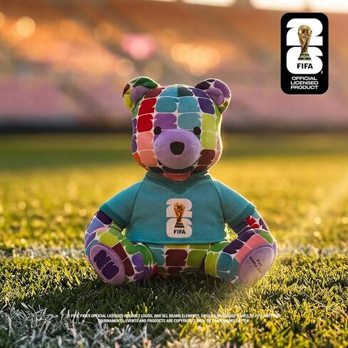 دب ملون من القطيفة مقاس 10 بوصات لكأس العالم FIFA 2026 من Jazwares - يمكن تجميع كأس العالم 2026 رسميًا مع تي شيرت بشعار كأس FIFA - للأعمار من 3 سنوات فما فوق in Kuwait
